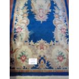 A 20th century Chinese blue ground rug, (260cm x 90cm approx),