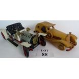 A vintage toy Rolls Royce with a steam powered engine (not tested) and a wooden car of similar