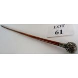 An Edwardian swagger stick with silver handle (Birmingham 1916) and brass ferule, 77cm long,