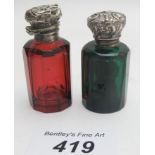 Two 19th century glass scent bottles, one red and one green, (one lid a/f),