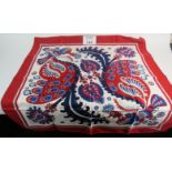 A Hermes silk scarf with a "Skyrose" pattern of blues and red on a white ground in a phoenix and