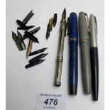 A collection of three vintage Parker pens, a dip pen and a collection of nibs,