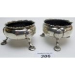 A pair of Georgian silver salts on shell feet, London hallmarks worn,