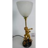 A modern table lamp with a frosted glass shade,