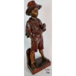A plaster statue of a boy with a bronzed finish, 62cm tall,