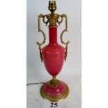 An ornate Classical-Revival gilt-metal and pink glass table lamp, 40cm high,