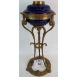 A fine late 19th century Classical-Revival gilt-metal lamp base with blue glass reservoir,