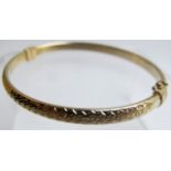A 9ct gold bangle with safety clasp, approx 6 grams,