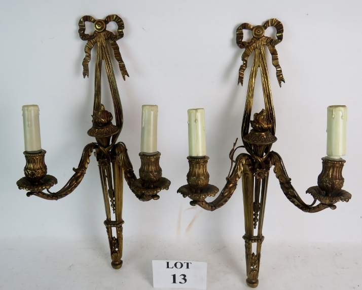 A pair of heavy quality vintage Neo Classical Revival gilt-metal wall lights, with cast decoration,