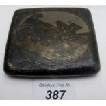 A Russian silver cigarette case with horse and cart decoration,