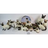 A collection of Siamese cat figures, mainly Beswick and Royal Doulton,