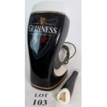 An illuminated Guiness draught tap,modern, 30cm tall,