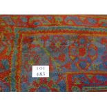 A large wool carpet, thick pile on red ground, with blue and green, (370cm x 330cm approx),