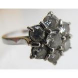 An 18ct white gold diamond cluster ring, consisting of seven diamonds, centre diamond approx .