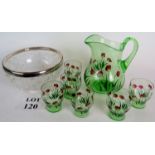 A green glass jug and six matching glasses hand decorated with tulips and a cut glass bowl with