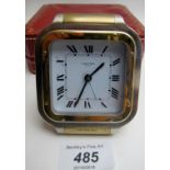 A Cartier Paris Colissee travelling alarm clock, in associated Cartier box,