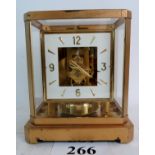 A Jaeger-LeCoultre Atmos clock, 24cm high, with booklet,