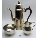 A heavy three piece silver coffee set, comprising of coffee pot, cream jug and sugar bowl,