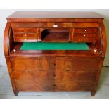 A fine Victorian figured walnut cylinder bureau with a fully fitted interior and pull out writing