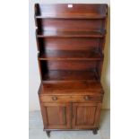 A small Georgian mahogany waterfall bookcase with 3 shelves over a single drawer and cupboard