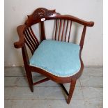 A 20th century mahogany corner chair, upholstered in pale blue material,