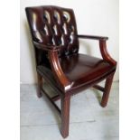 A 20th century mahogany framed armchair/desk chair upholstered in a button backed Burgundy leather