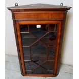 An Edwardian mahogany inlaid corner wall cupboard with 13 pane astral glazed door,