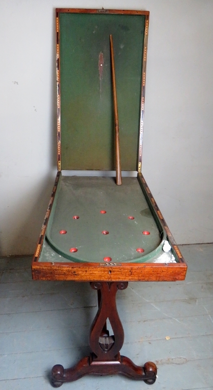 A Victorian mahogany bagatelle board on an associated base, slightly a/f,