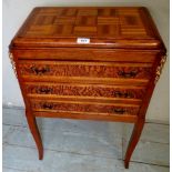 A small decorative French side cabinet, with three carved drawers and gilt metal mounts,