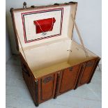 A vintage wooden bound travelling trunk by Antoine Moli,