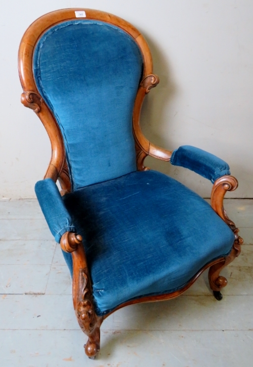 A Victorian pale walnut gentleman's armchair upholstered in blue,