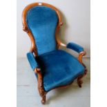 A Victorian pale walnut gentleman's armchair upholstered in blue,