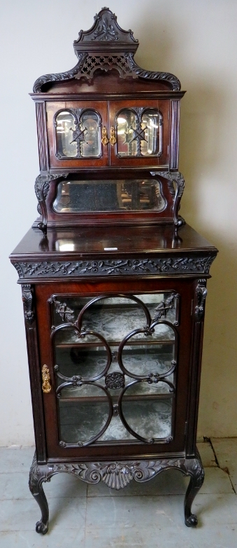 An Edwardian mahogany slim display cabinet, very ornate,