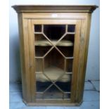 A small 19th century pine corner cupboard,