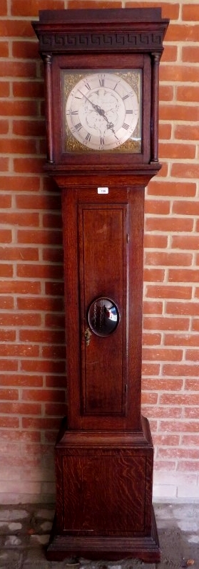 A Georgian oak carved 30 hour longcase clock with square silvered dial with gilt filigree