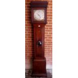 A Georgian oak carved 30 hour longcase clock with square silvered dial with gilt filigree