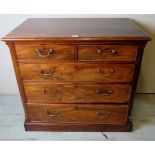 A Georgian mahogany chest of 2 over 3 long drawers with flame mahogany fronts and reeded cantered