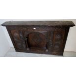 A decorative 19th century carved oak overmantle with a recessed central shelf,