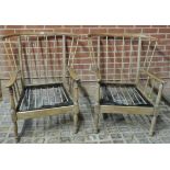 A pair of 20th century Ercol design spindle back Windsor single armchairs with original loose