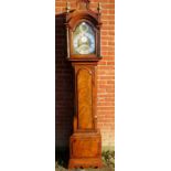 A fine 18th century flame mahogany cased longcase clock with an arched dial,