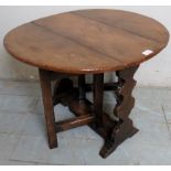 A small 20th century oak drop leaf gateleg side table,