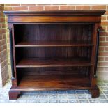 A 20th century mahogany low open bookcase with two shelves,