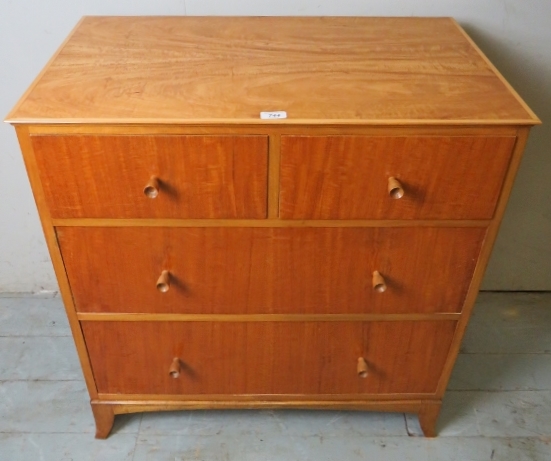 A mid 20th century satinwood chest of 2 short over 2 long drawers bearing a label James Colmer BATH,