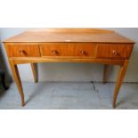 A mid 20th century satinwood side table or desk with 3 drawers and label for James Colmer BATH,