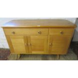 A 1960/70's Ercol style honey sideboard with 2 drawers over 3 cupboards,