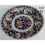 19th century Imari dish with old staple