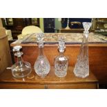 FOUR VARIOUS GLASS DECANTERS AND STOPPERS to include one Dartington example