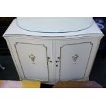 A MARIE-ANTIONETTE DESIGN TWO-DOOR SERPENTINE FRONTED SHOE CUPBOARD