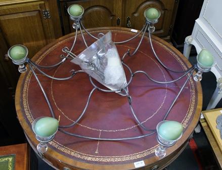 A MODERNIST METAL FRAMED AND GLASS CEILING CHANDELIER, having six candle topped branches and