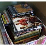 A BOX CONTAINING A SELECTION OF HOME ENTERTAINMENT to include pre-recorded DVDs and a selection of